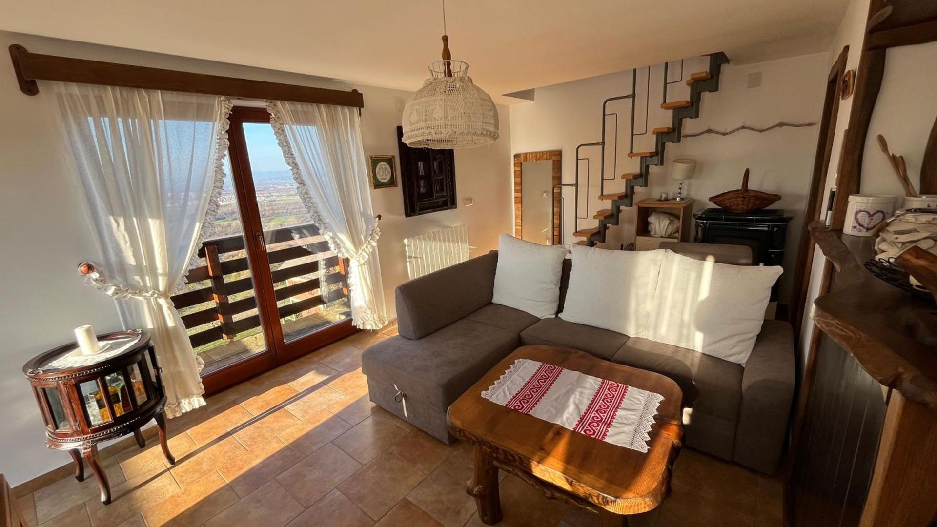 Living room with sofa and doors open to the balcony